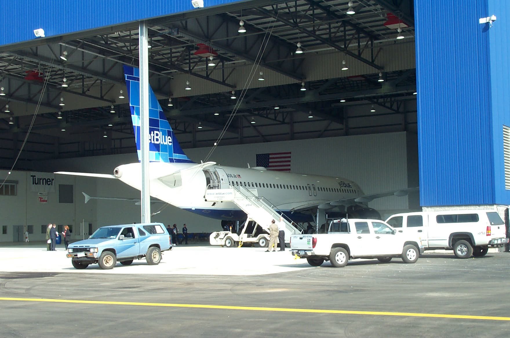 Plane entering hangar 