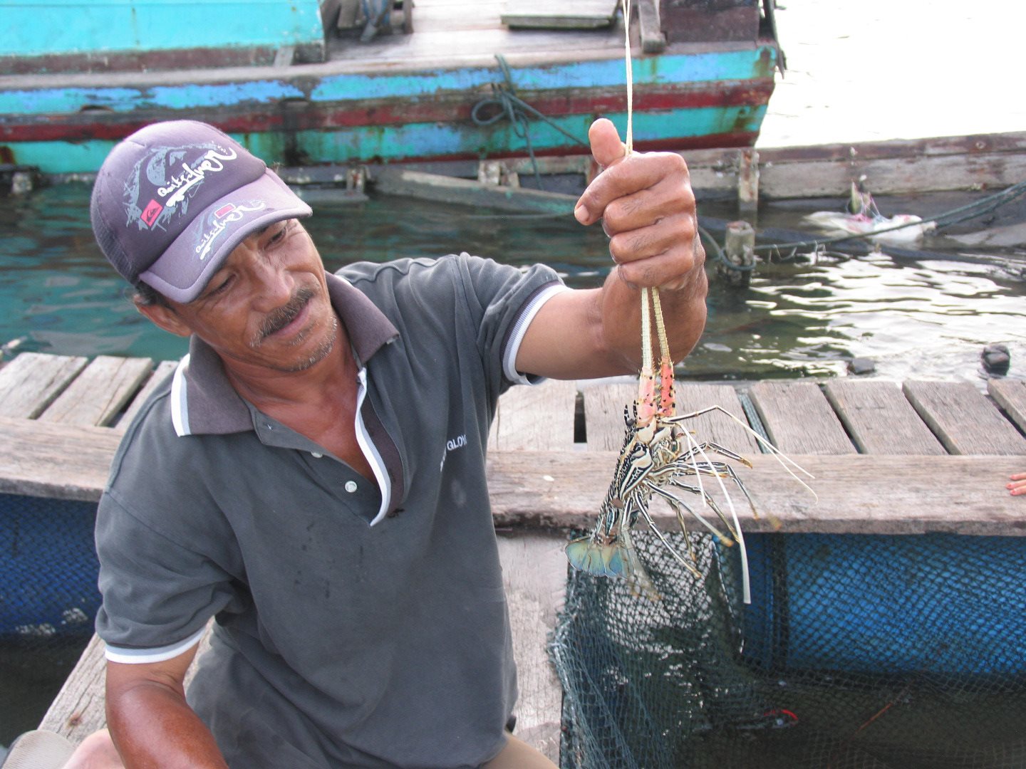 Fisherman holding large fish