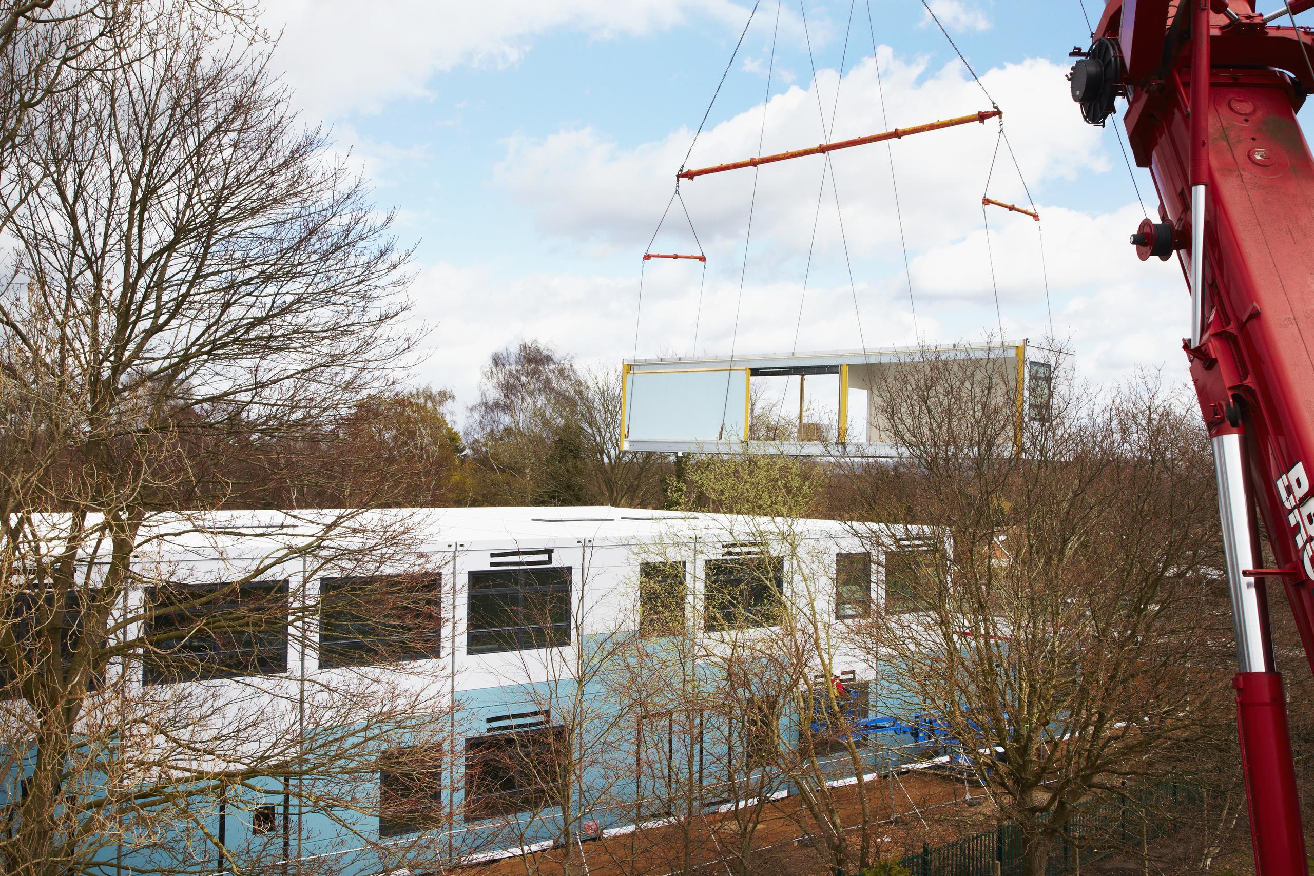 Part of Pyrford Primary School's Yorkon design building being craned onto the rest of the building