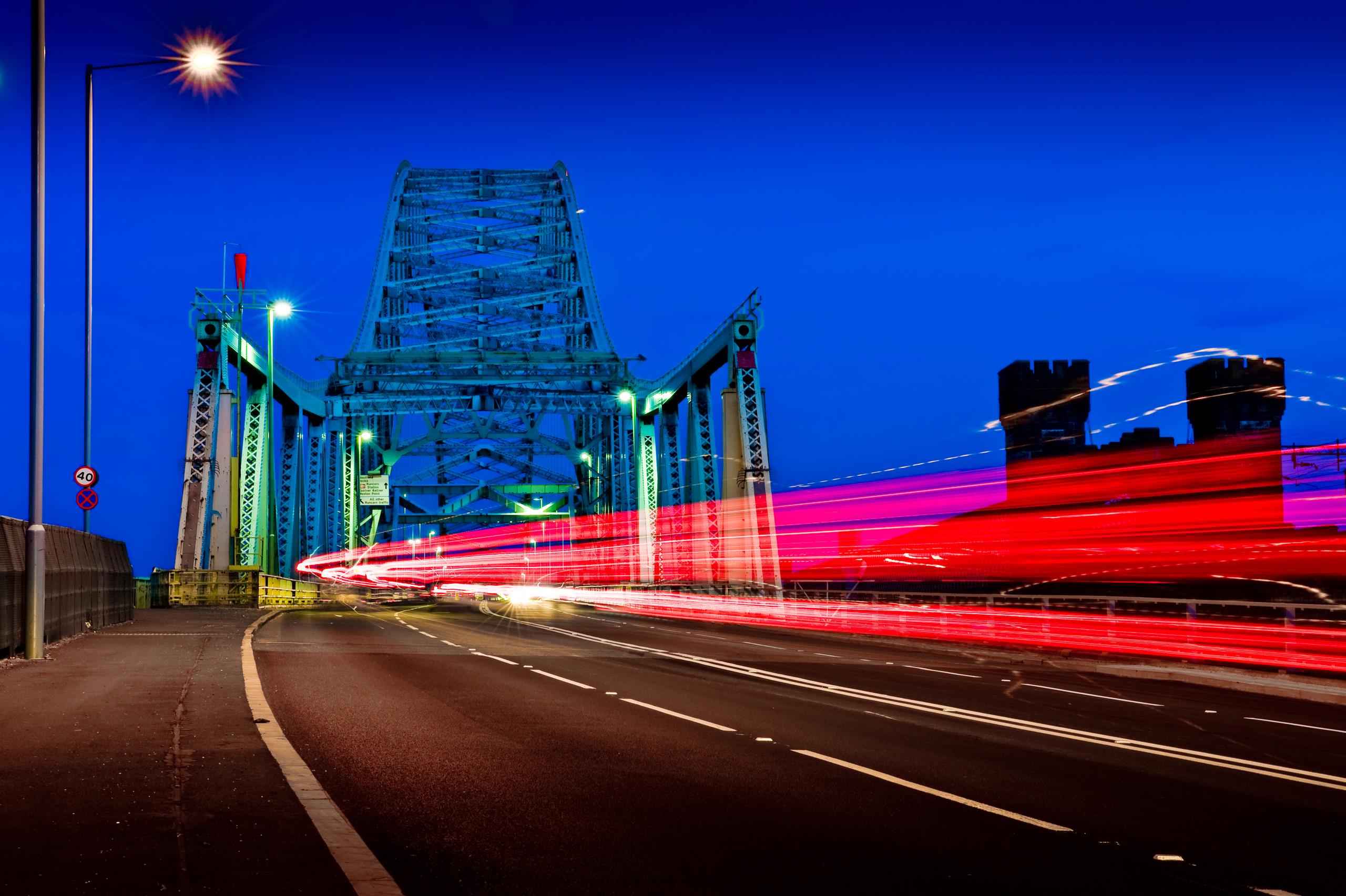 The Silver Jubilee Bridge at night, with light effect that has been caused by the cars rushing by