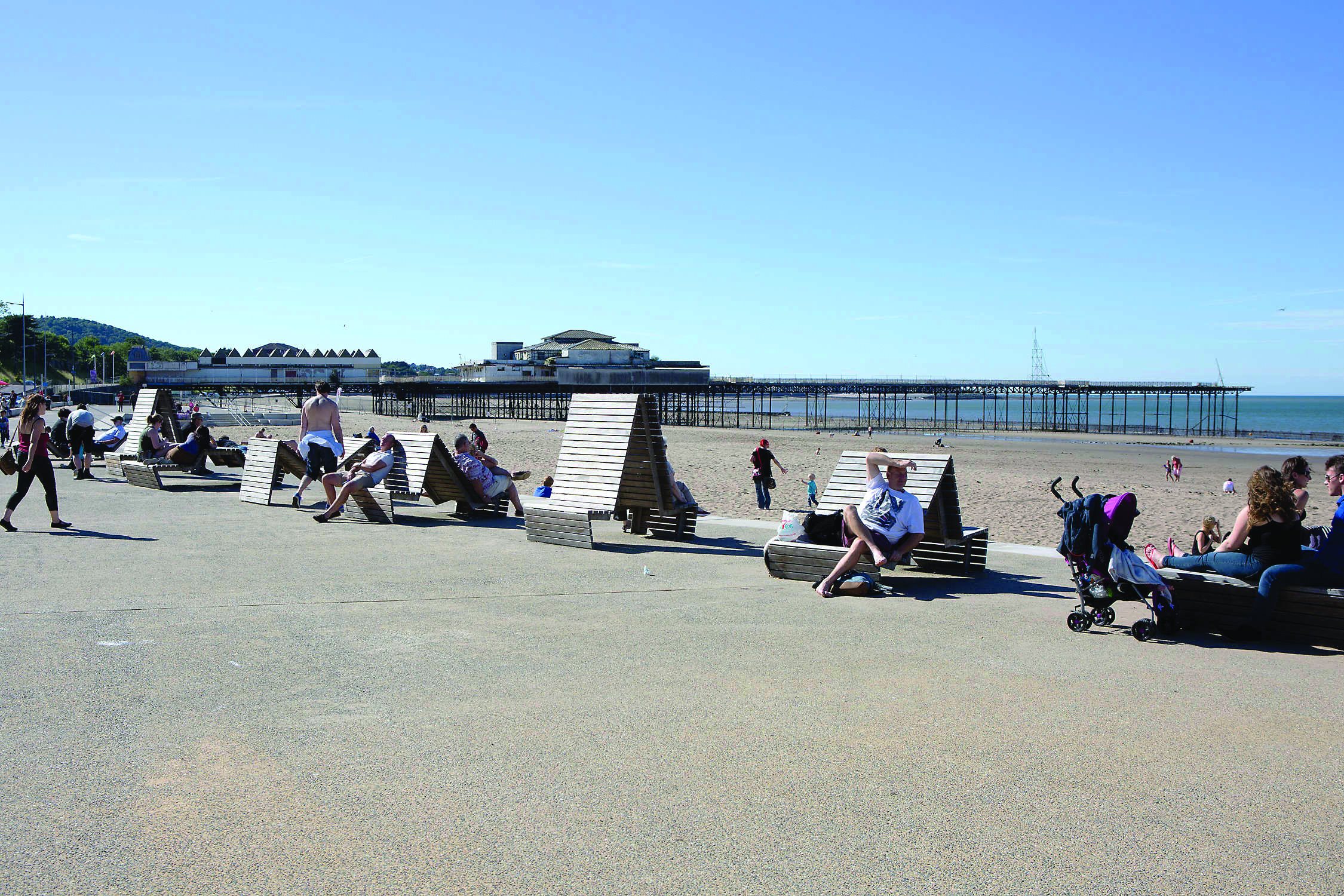 People enjoying a sunny day at Colwyn Bay, Wales