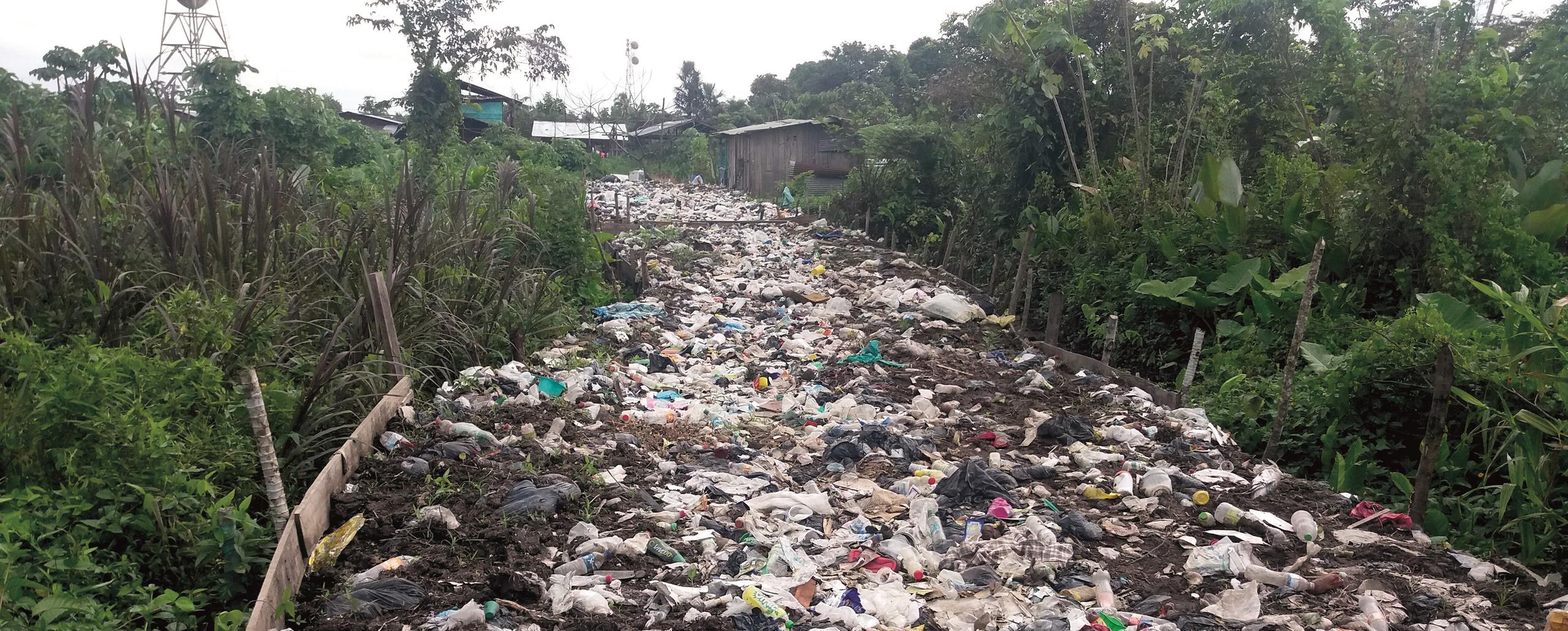 Waste scattered across all of the street in one of Colombia's isolated municipalities