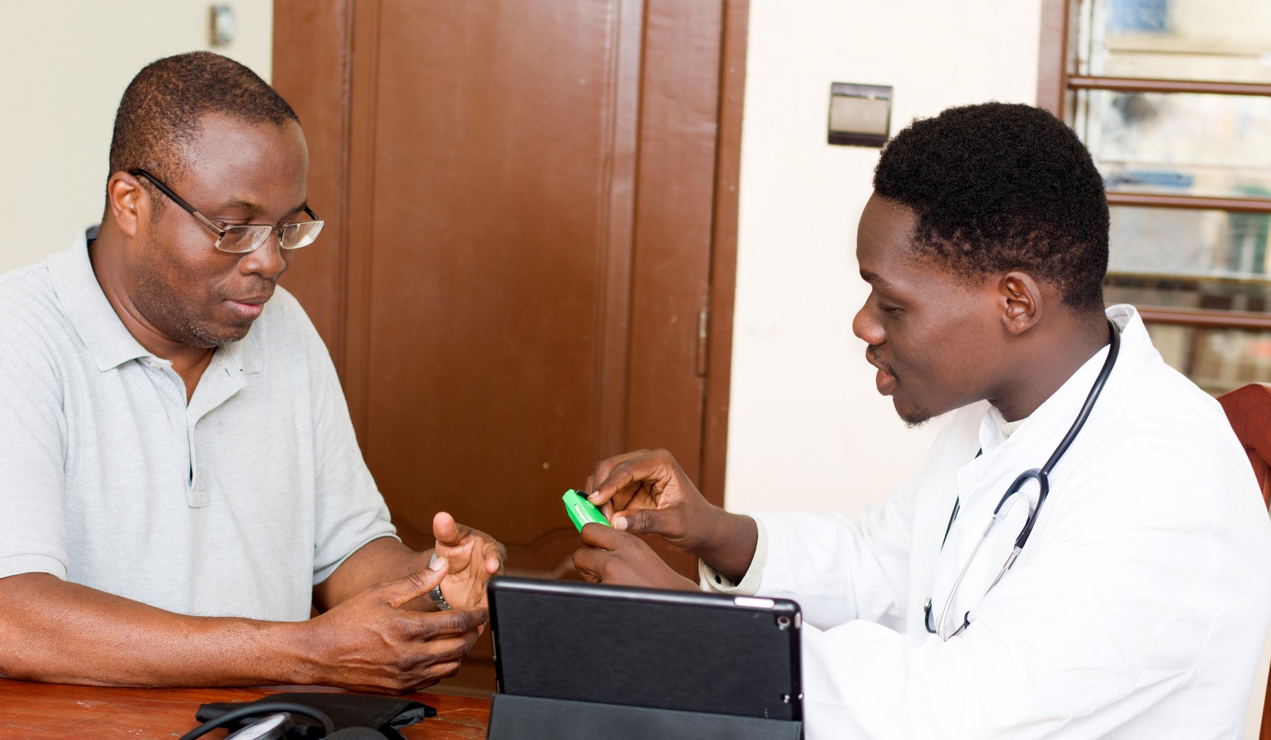 A doctor and patient using the electronic immunisation registry system