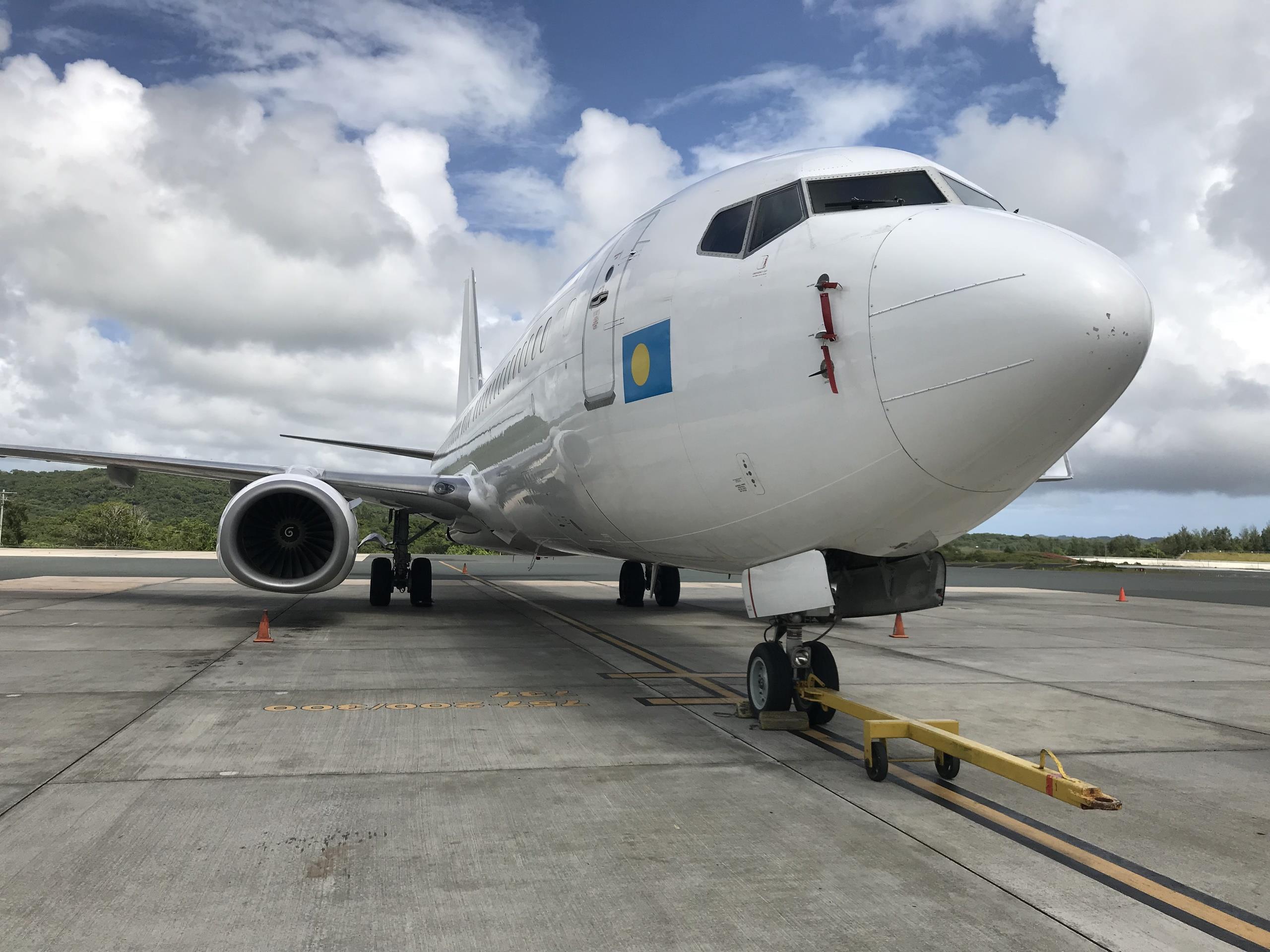 A plane on a runway at Palau International Airport