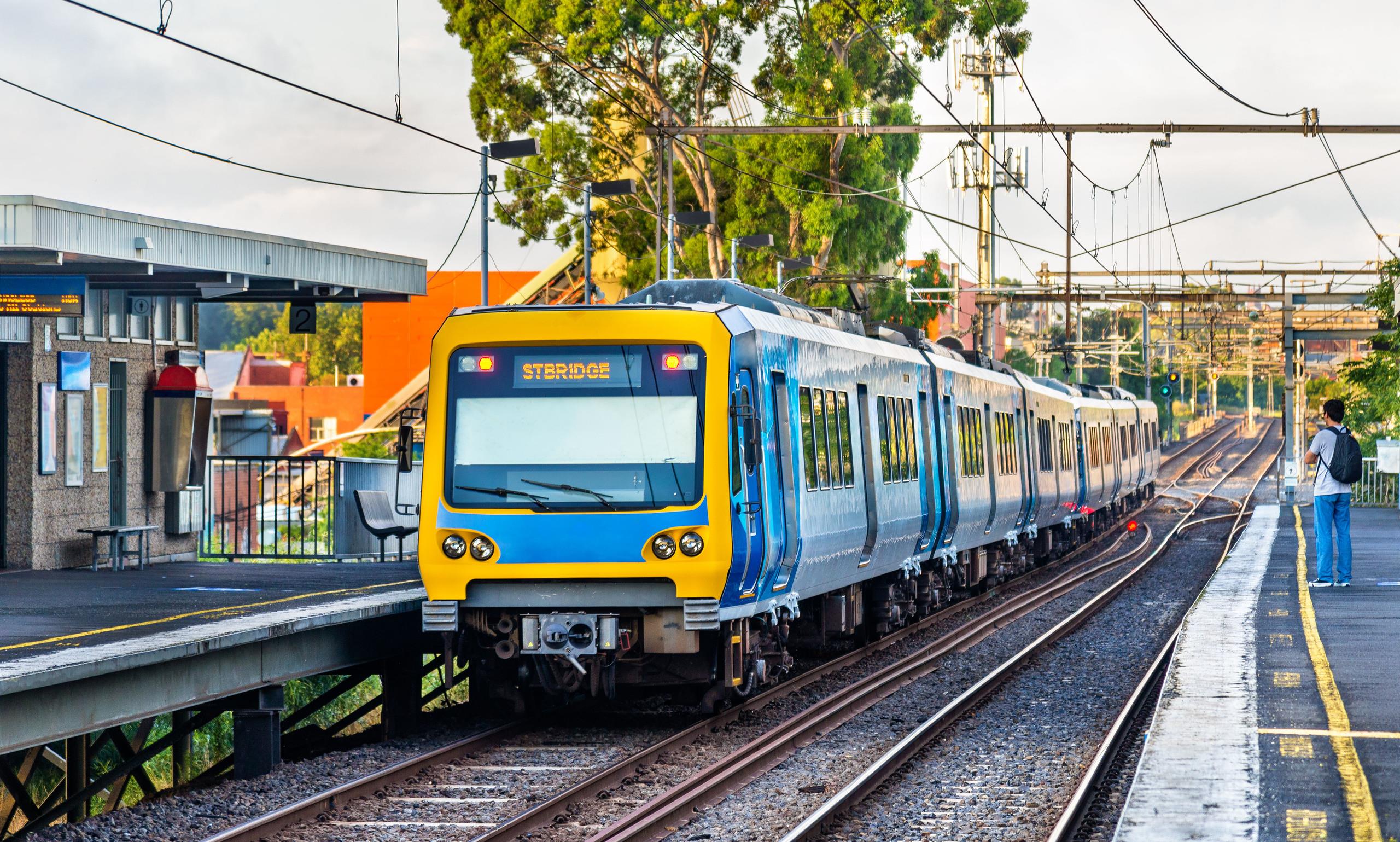 A Melbourne metro train travelling through a station