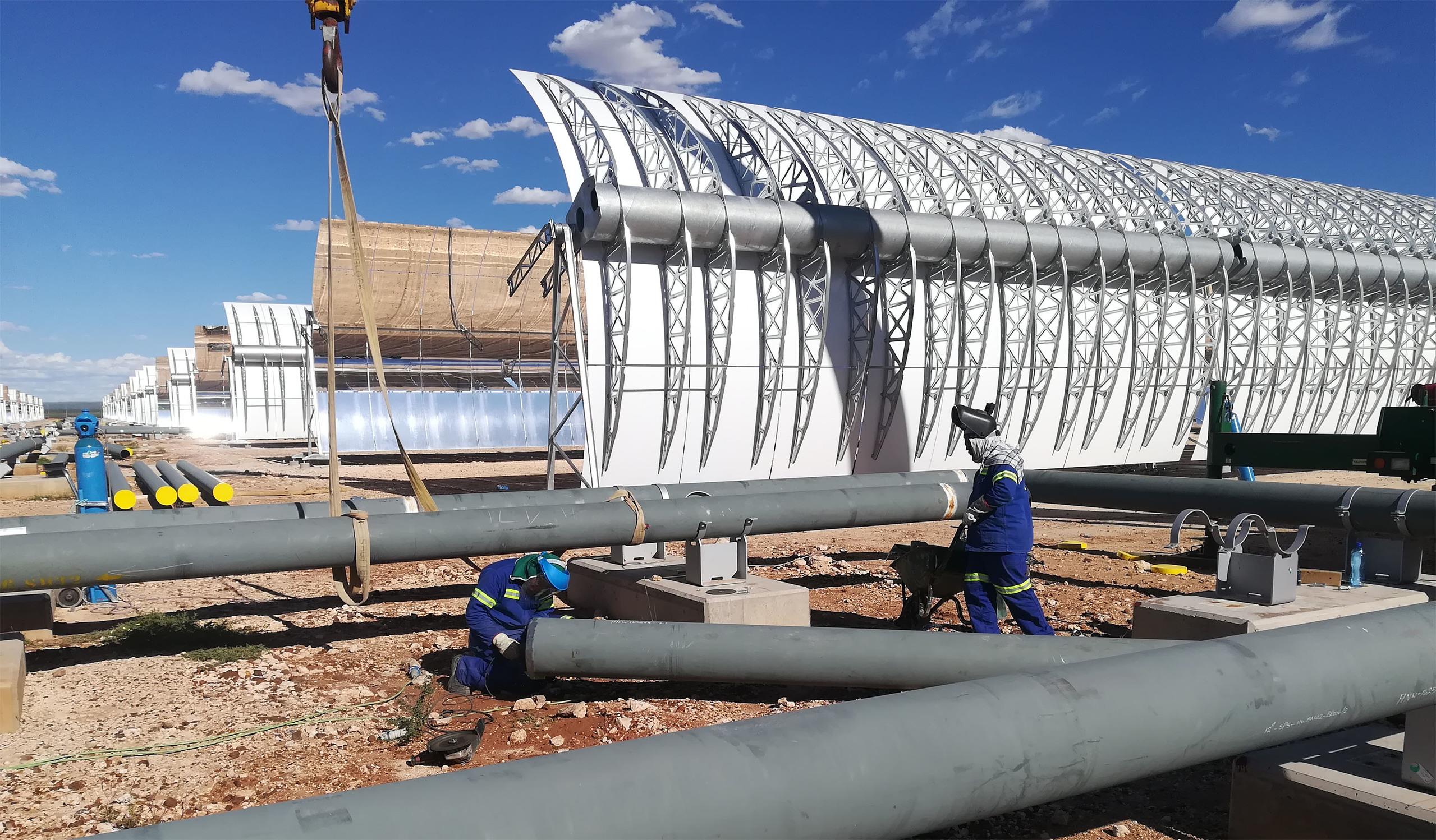 Workman constructing part of the solar power system at Kathu solar park