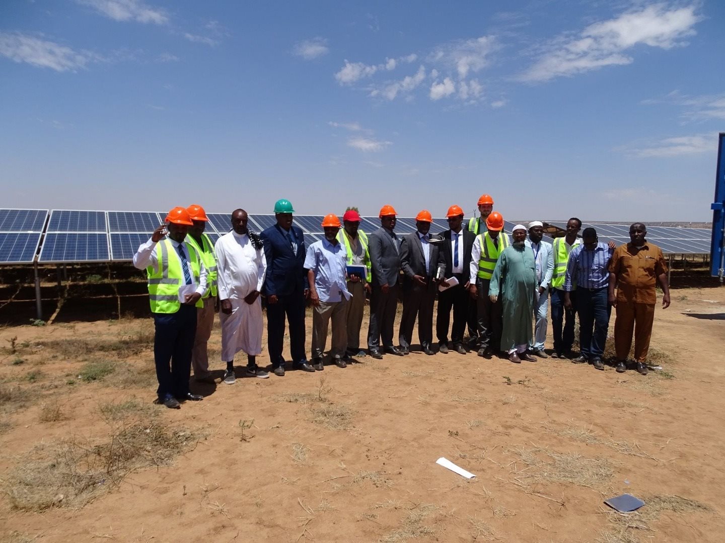 The ESRES team stand near solar panels in Somaliland