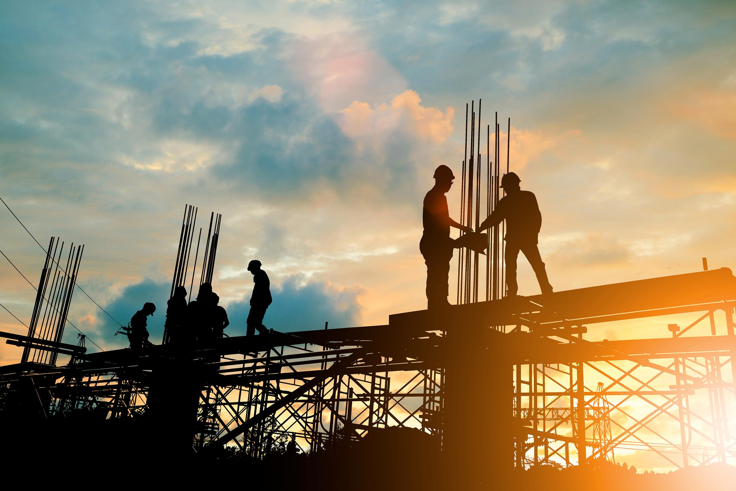 Silhouette of engineer and construction team working at a site