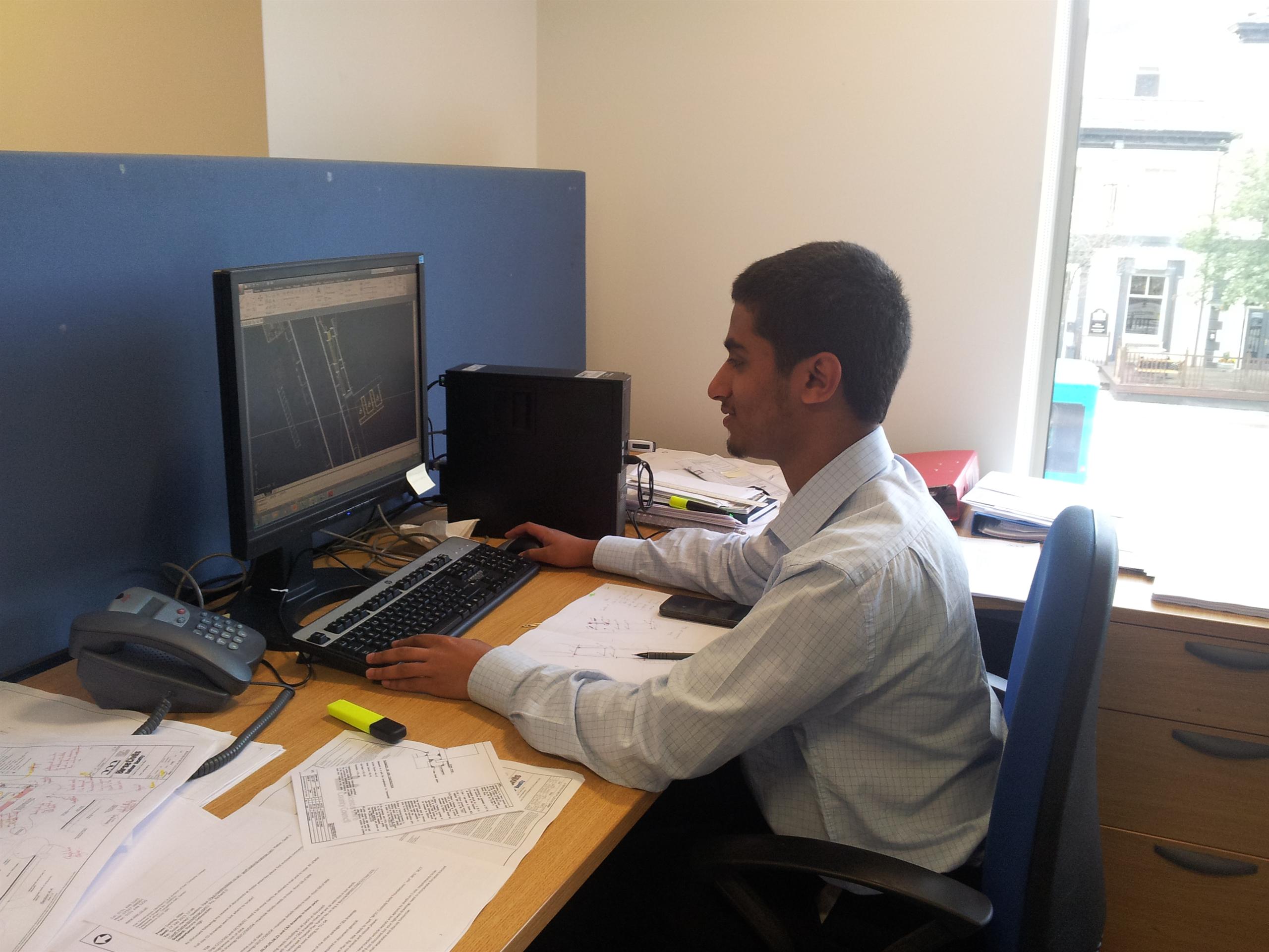 Mustafa in the Manchester office