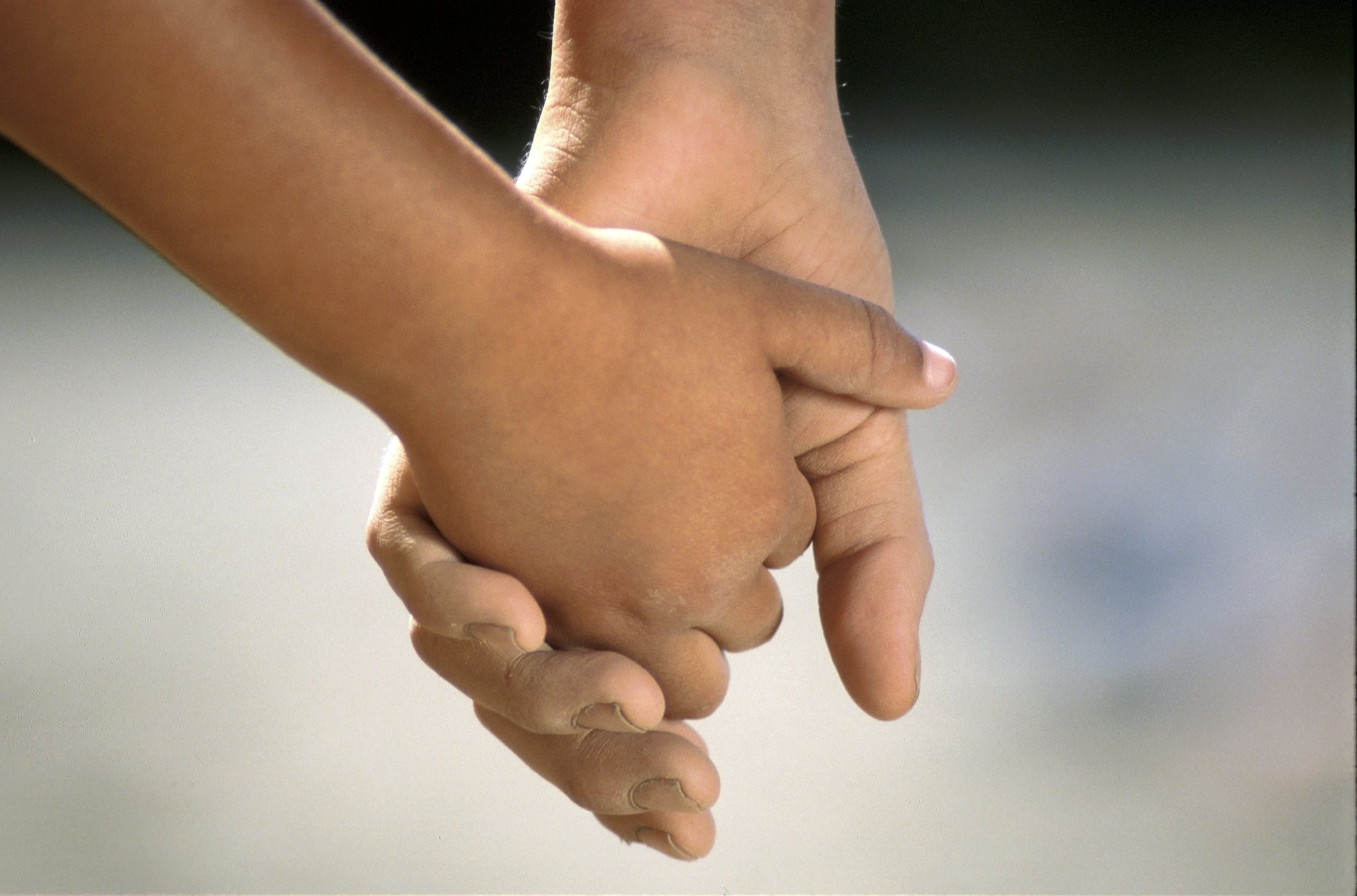 Children’s social care image of two children holding hands