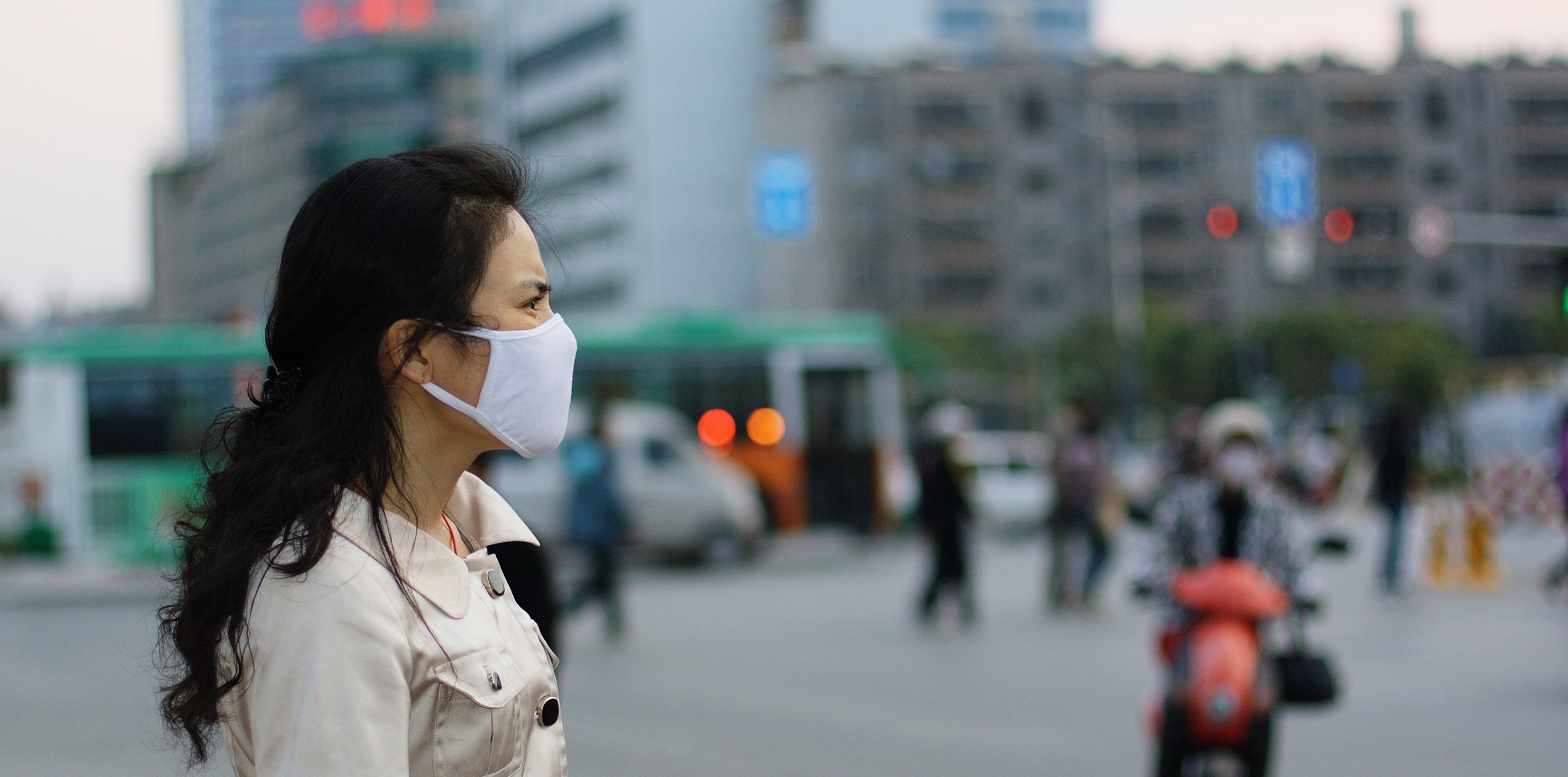 Lady wearing a protective face mask against pollution