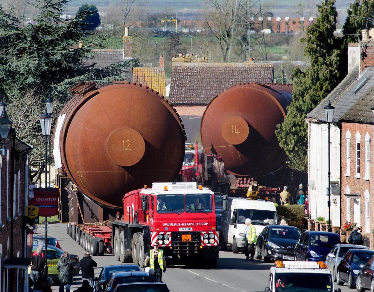 Two of the boilers being transported through the town of Berkeley