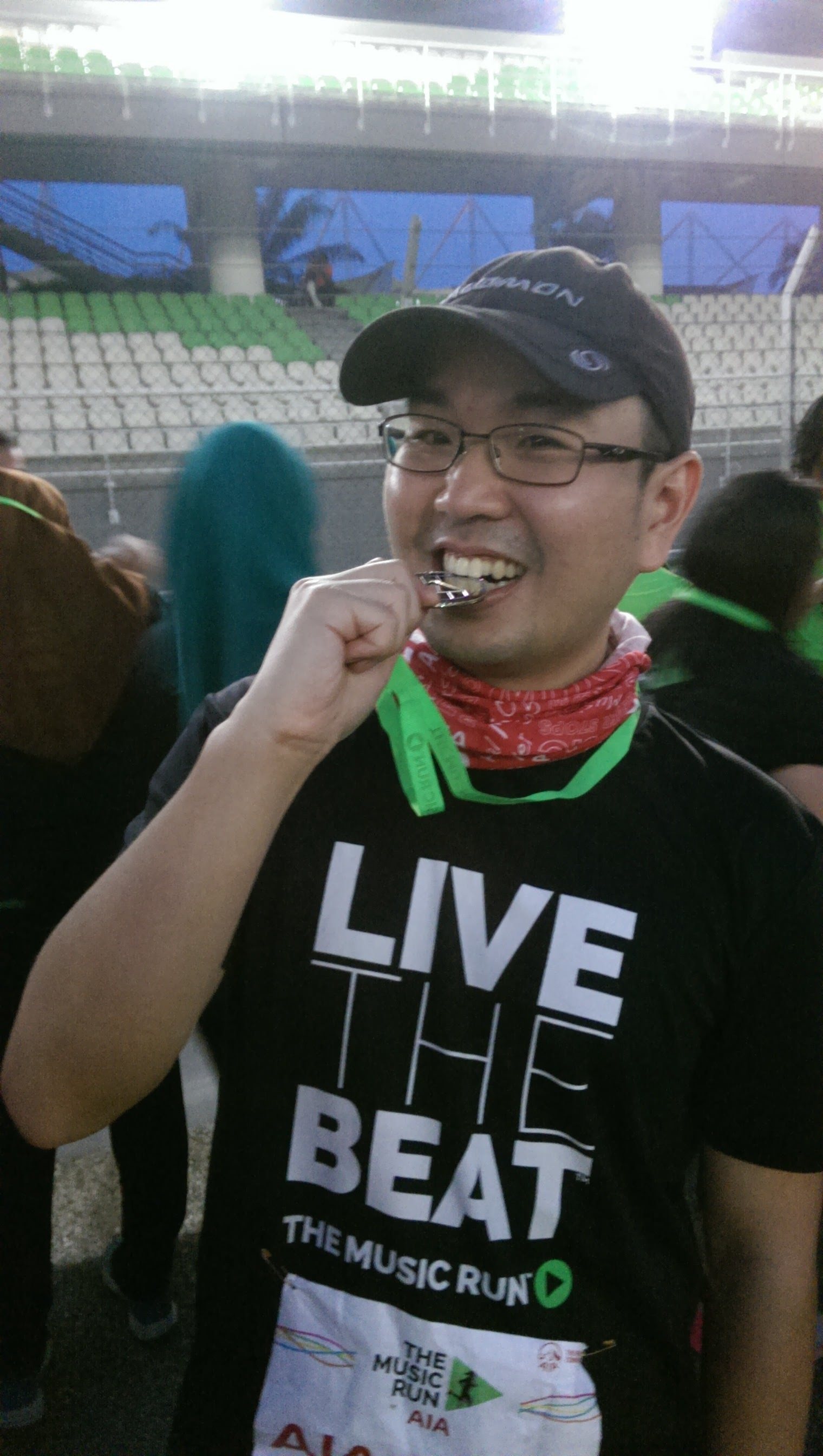 Kai En with his finisher's medal from Music Run 2015 at Sepang International Circuit