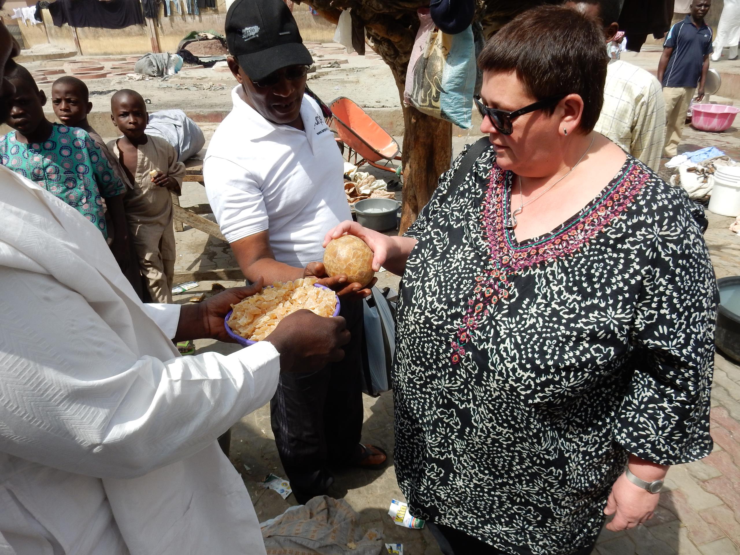 Caroline discussing the quality of locally produced soap in Kano, Nigeria