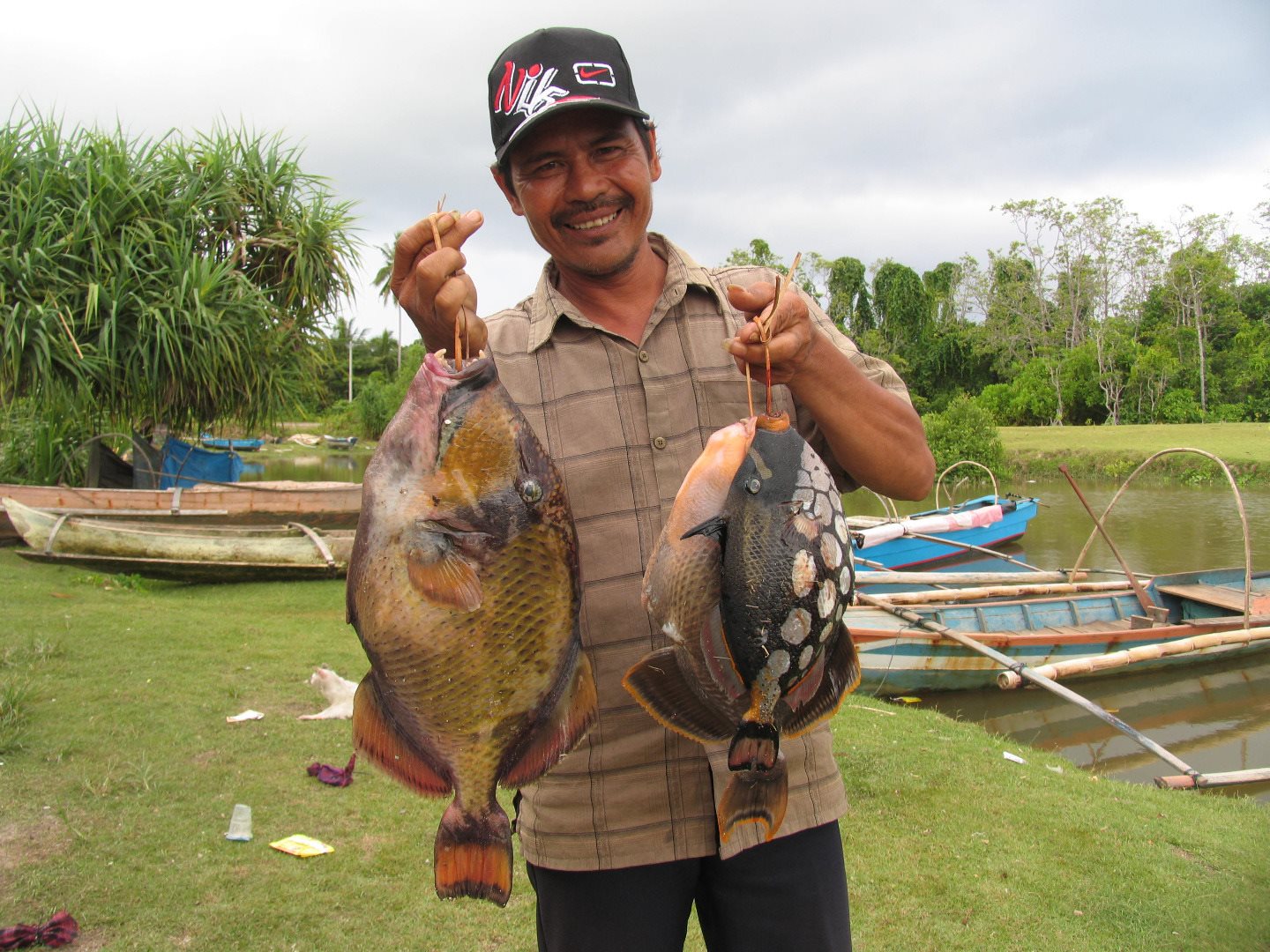Man holding fish in Aceh indonesia