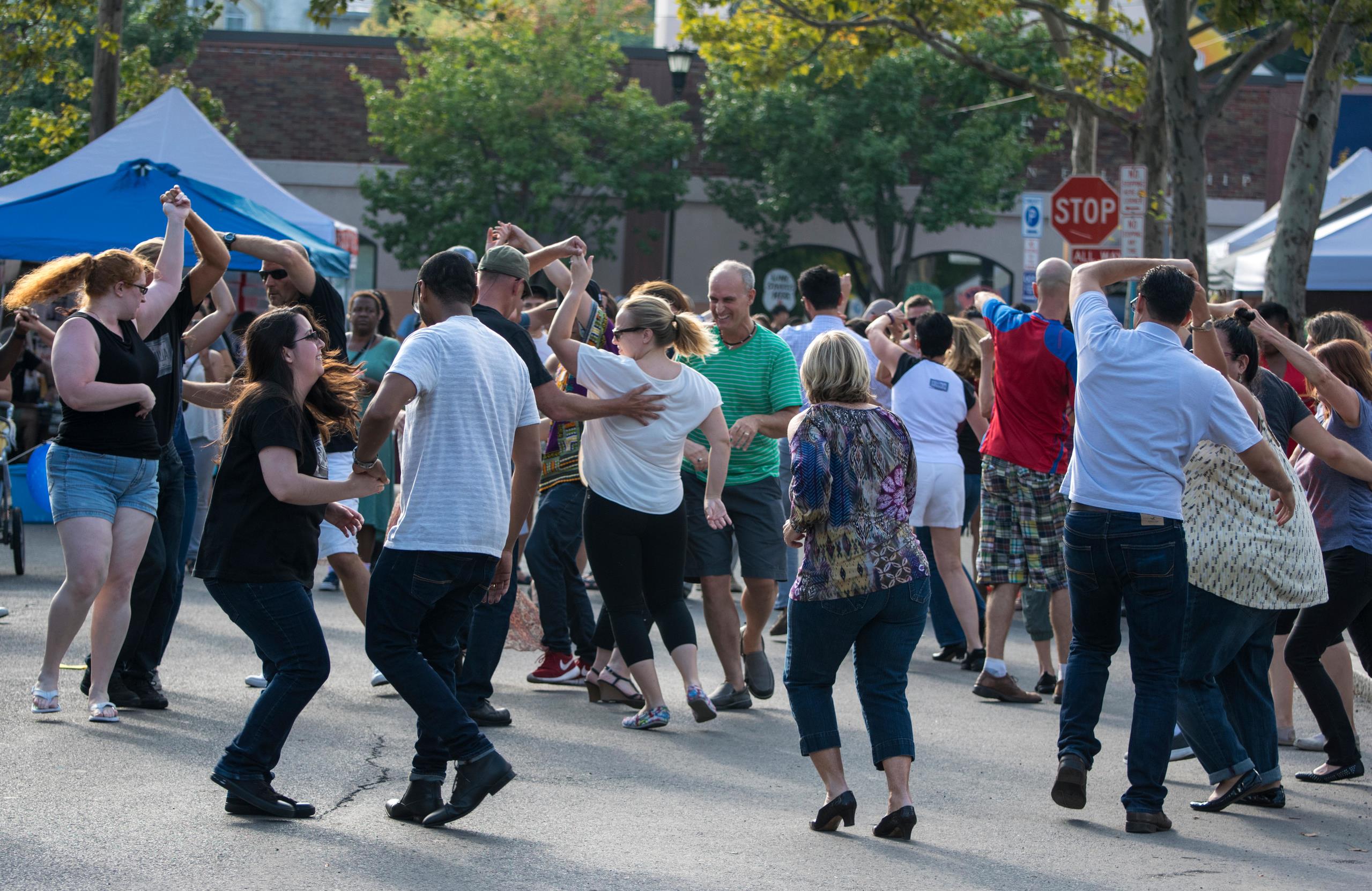 Group of people dancing at a street party