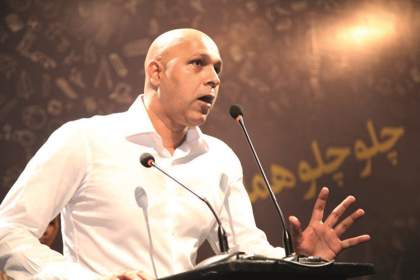 Imran Azhar, the creator of AzCorp, speaking at a conference