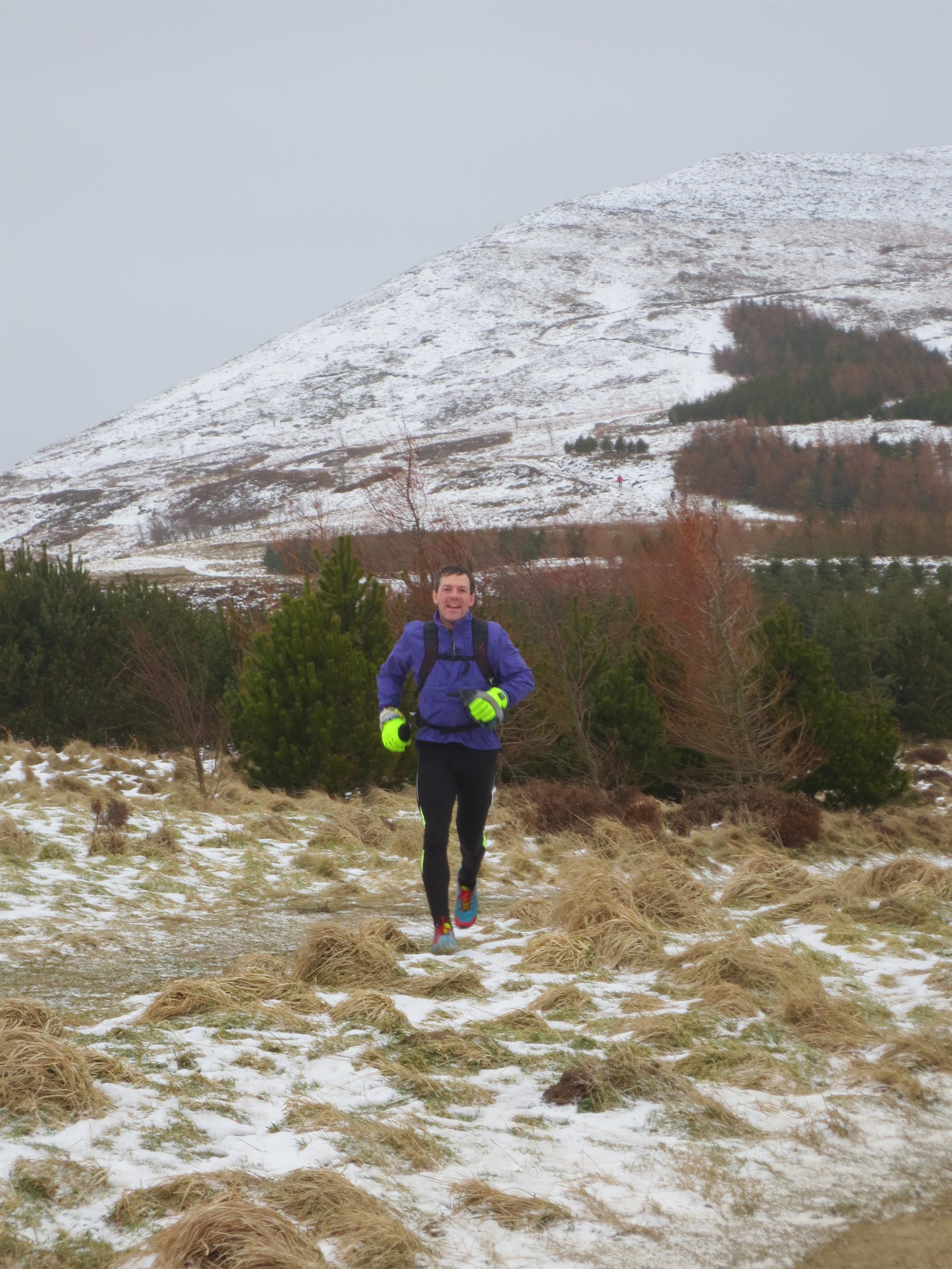 John approaching Lordstones on the Hardmoors 55 Ultramarathon. It was a day out in the countryside and a great event, but it was a struggle to run 55 miles across the North Yorkshire Moors in the snow.